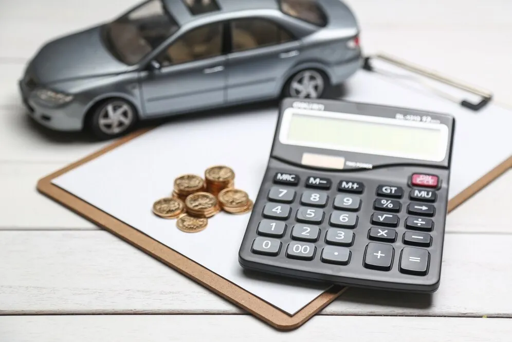 car-model-calculator-coins-white-table_1387-493
